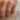 person-wearing-wide-gold-band-with-two-main-diamonds-and-one-accent-diamond