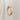Gold ring on a light gray background