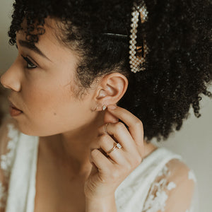bride wearing diamond kite earrings