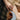 woman-holding-hand-held-mirror-wearing-gold-rings