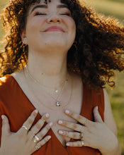 Load image into Gallery viewer, smiling-curly-haired-woman-wearing-handmade-silver-and-gold-jewelry