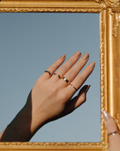 Load image into Gallery viewer, hand-towards-the-sky-wearing-black-diamond-rings-and-gold-bands