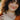 woman-wearing-gold-paperclip-chain-necklace-layered-with-others