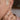Person wearing a wide band with a north to south set marquise diamond in a bezel setting