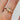 round-diamond-green-sapphire-cluster-engagement-ring