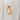 Tall, melty gold ring on a light gray background