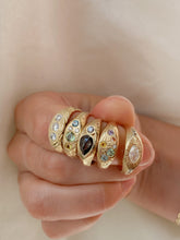 Load image into Gallery viewer, Hand-wearing-a-handful-of-signet-rings-with-different-gemstone designs