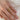Person-wearing-stack-of-trilogy-three-stone-gemstone-rings