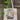 Canvas tote with a picture of cat lying on a fainting couch with plants hanging on the wall behind it.