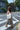 Woman crossing the street wearing a canvas tote on her shoulder