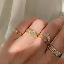 Load image into Gallery viewer, Woman-wearing-14k-yellow-gold-signet-ring-set-with-colorful-sapphires-with-a-hand-engraved-designs