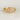 A gold ring with three white diamonds set in a hand-engraved pattern on the band.
