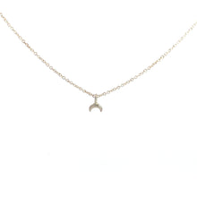 Load image into Gallery viewer, A crescent moon pendant necklace made of silver, displayed on a plain background.