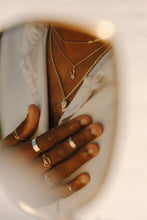 Load image into Gallery viewer, man-in-mirrored-reflection-wearing-chunky-skull-necklaces-and-rings