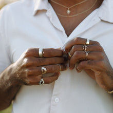 Load image into Gallery viewer, man-wearing-silver-and-gold-stacking-rings-and-half-halos