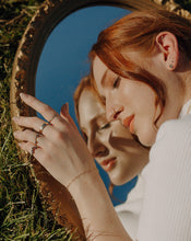 Load image into Gallery viewer, woman-wearing-gold-bands-and-black-diamond-rings