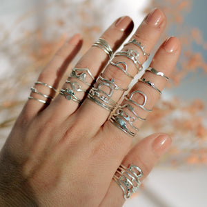 hand-full-of-silver-rings