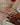 circle-of-hands-wearing-lots-of-silver-and-gold-rings-and-bands