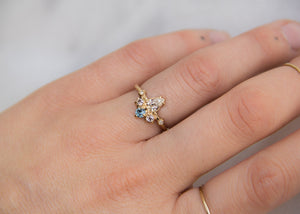 pear shaped, brilliant cut diamond with a crown of diamonds and sapphire 