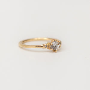 recycled 14k gold band with large salt and pepper diamond