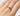 ethical-salt-and-pepper-diamond-and-ruby-ring-on-finger