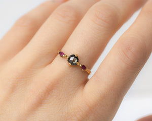 ethical-salt-and-pepper-diamond-and-ruby-ring-on-finger