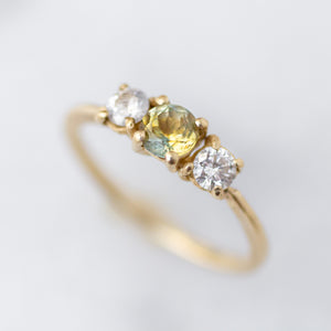 Three Stone Ring with a Blue/Yellow Parti Sapphire and two diamond accents
