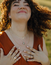 Load image into Gallery viewer, smiling-woman-tossing-hair-wearing-necklackes-and-stacks-of-rings