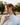 woman-in-rings-wearing-white-mock-neck-sweater-and-necklaces