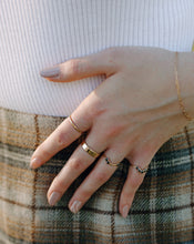 Load image into Gallery viewer, woman-wearing-gold-bands-and-black-diamond-rings
