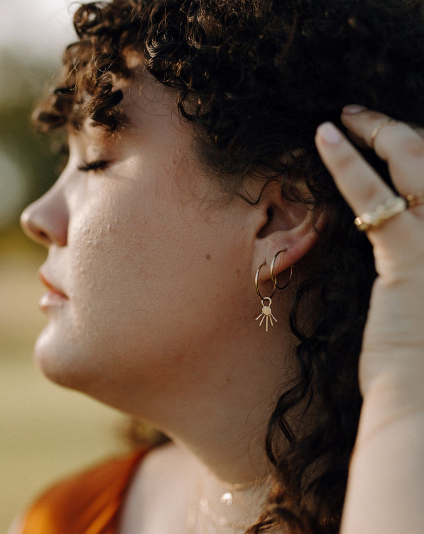 woman-wearing-double-hoops