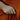 woman-in-rust-dress-wearing-gold-and-silver-rings