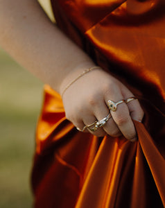 woman-wearing-chunky-mixed-metal-rings-