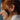 red-headed-woman-wearing-diamond-and-sapphire-gold-earrings