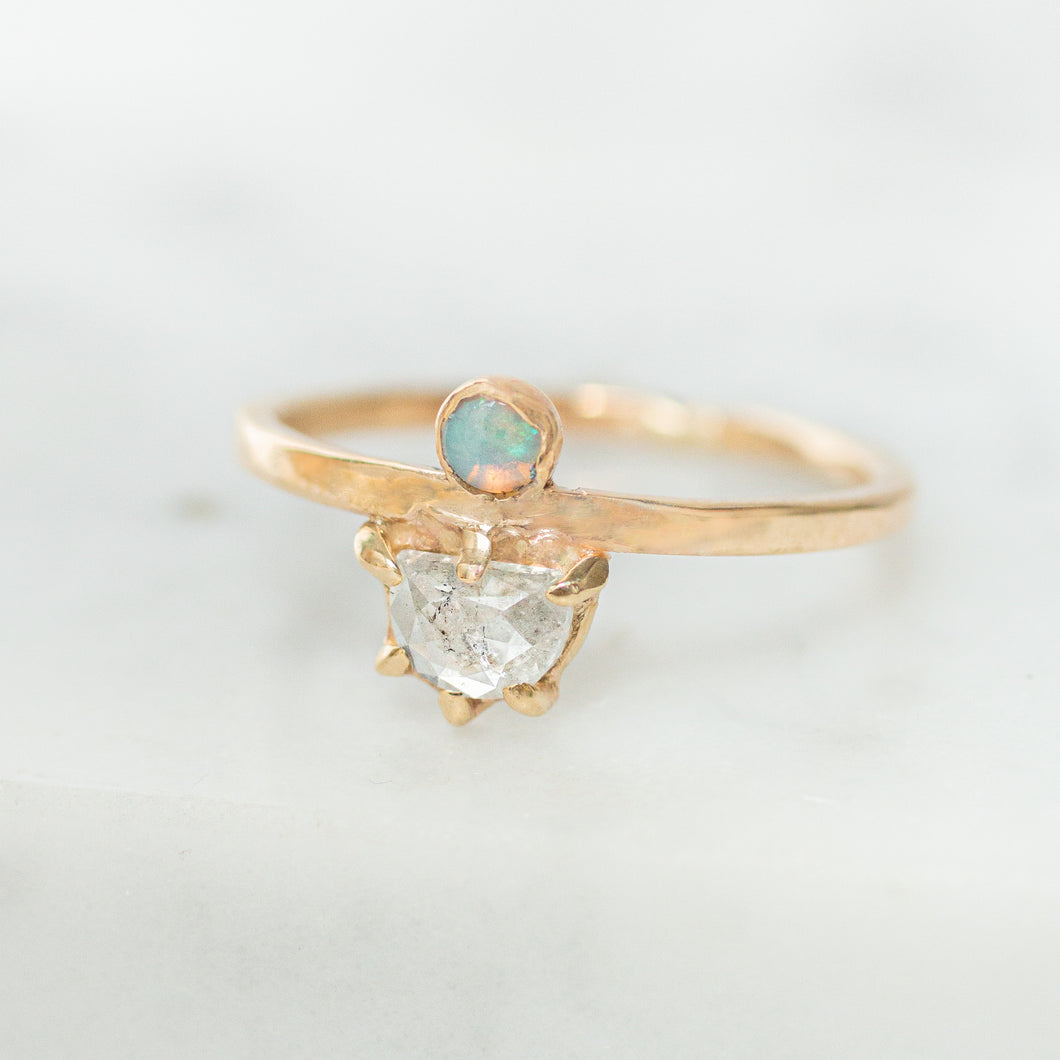 Rose cut diamond ring with a bezel set opal accent set in a band of 14k gold