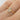 person wearing a rose cut diamond & opal 14k gold engagement ring
