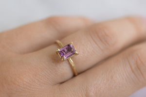 beautiful-reclaimed-ethical-amethyst-cocktail-ring-with-14k-gold-setting-and-band-on-finger