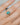 ethically made turquoise ring with recycled 14k gold band on hand
