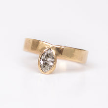 Load image into Gallery viewer, Gold band with a bezel set marquise diamond on a white background