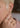 Person wearing a wide band with a north to south set marquise diamond in a bezel setting