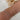 woman-wearing-stack-of-sterling-silver-and-14k-gold-bracelets