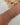 woman-wearing-stack-of-sterling-silver-and-14k-gold-bracelets