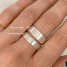 Load image into Gallery viewer, person wearing two sterling silver bands, one is 5mm tall and the other is 7mm tall