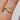 round-diamond-green-sapphire-cluster-engagement-ring